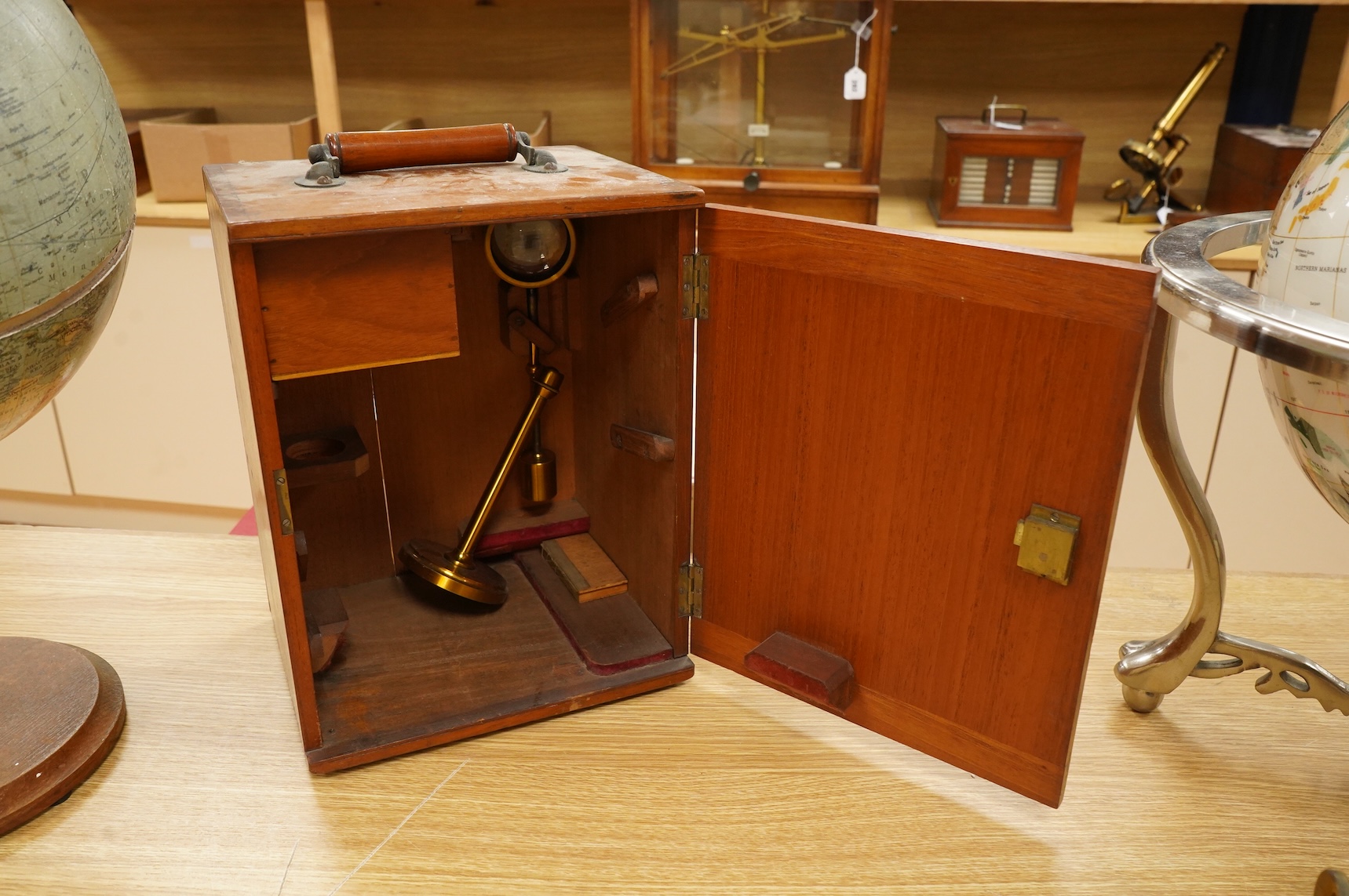 A early 20th century brass compound monocular microscope, by W. Watson and Sons, 313, High Holborn, London, number 9385, mahogany cased, with accessories including - four additional objectives, two eyepieces and a bull’s